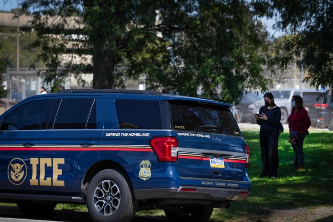 Activists monitor an ICE vehicle parked near the Cook County jail and courthouse complex on September 8, 2025 in Chicago, Illinois.