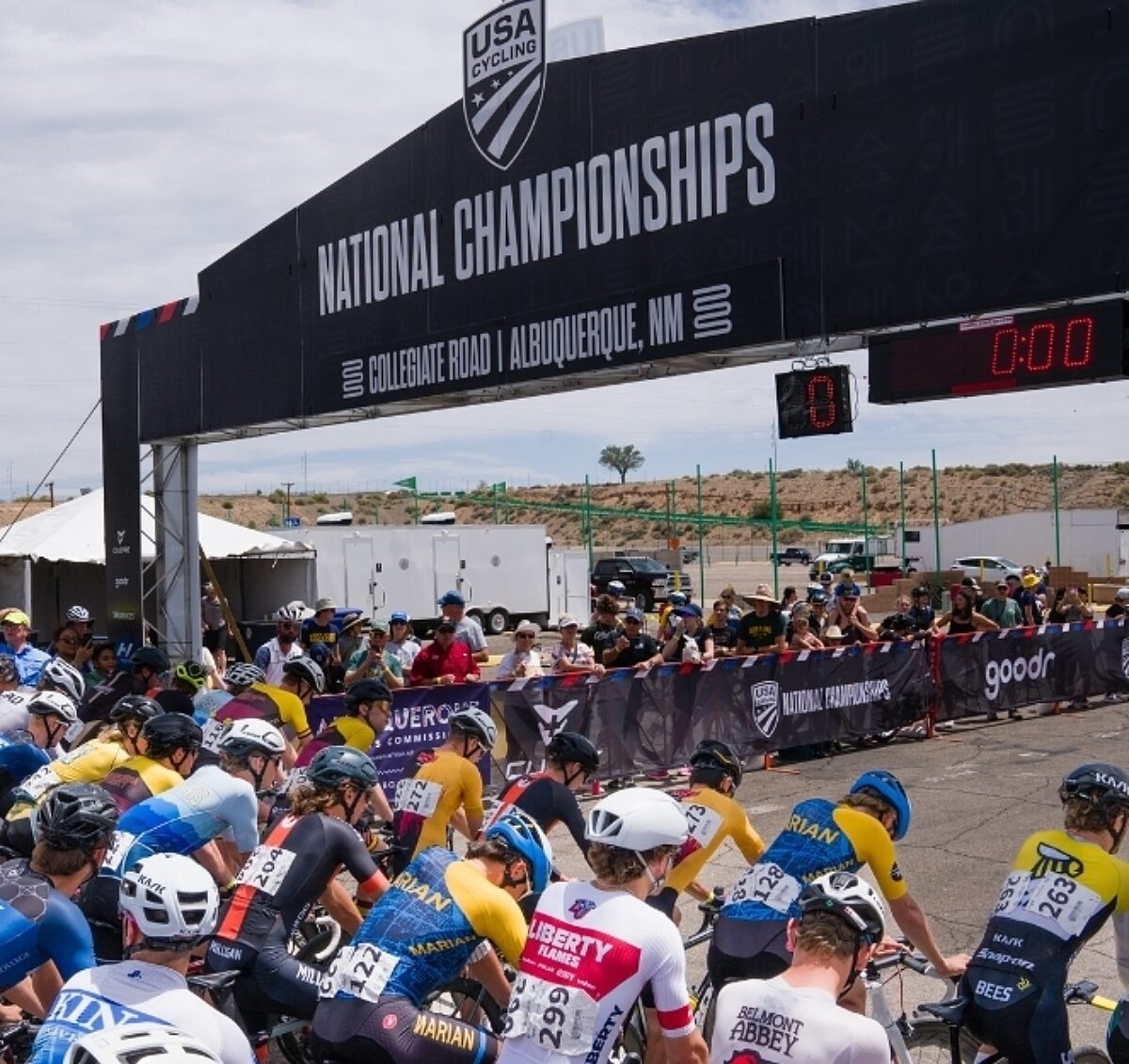 National championship start line; racers are in ready position.