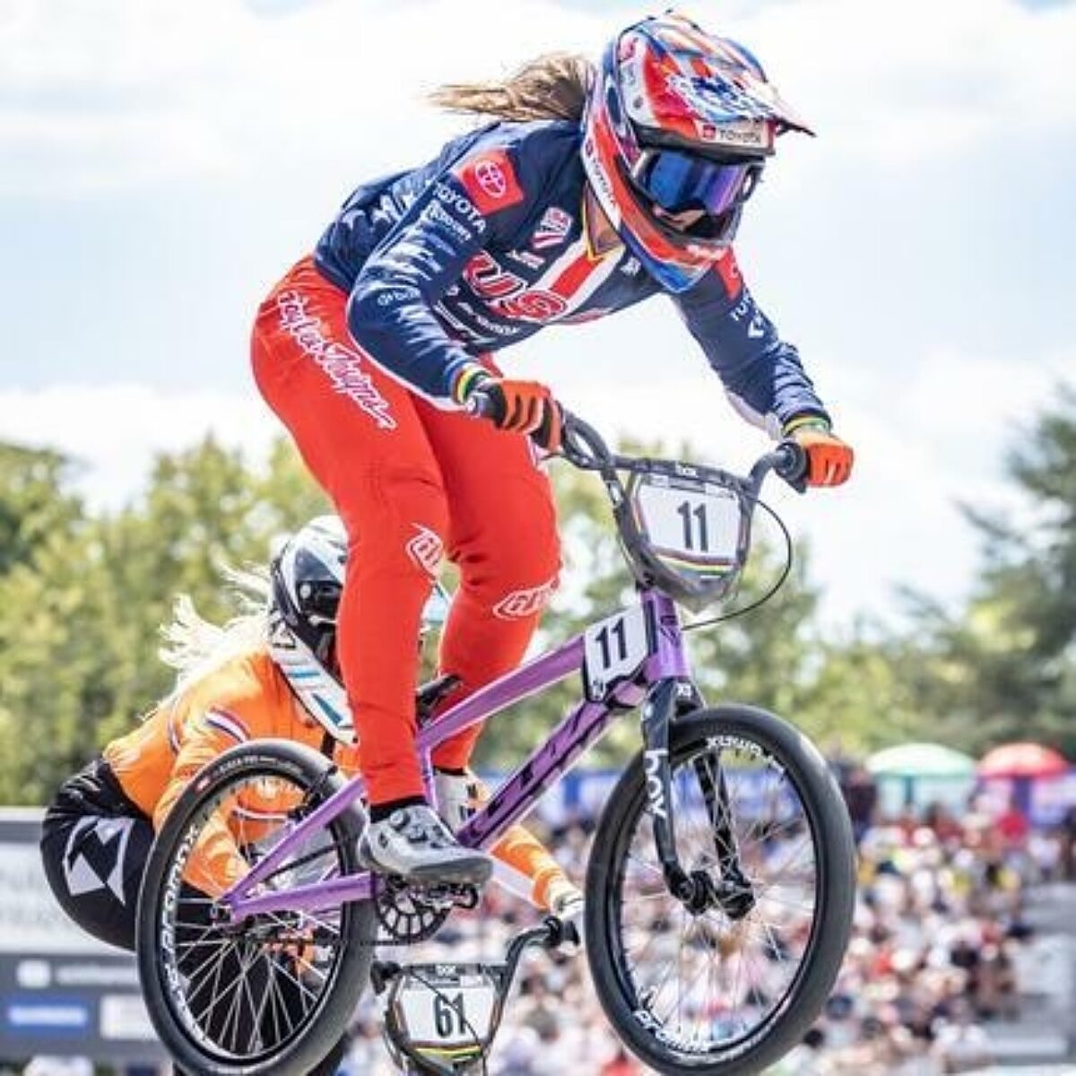 BMX racer about to catch air.