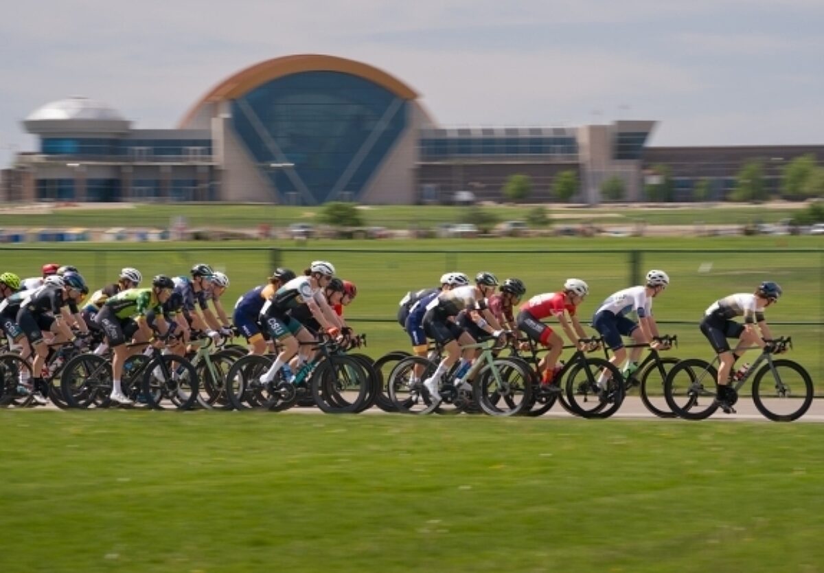 Group of collegiate riders in a road race.