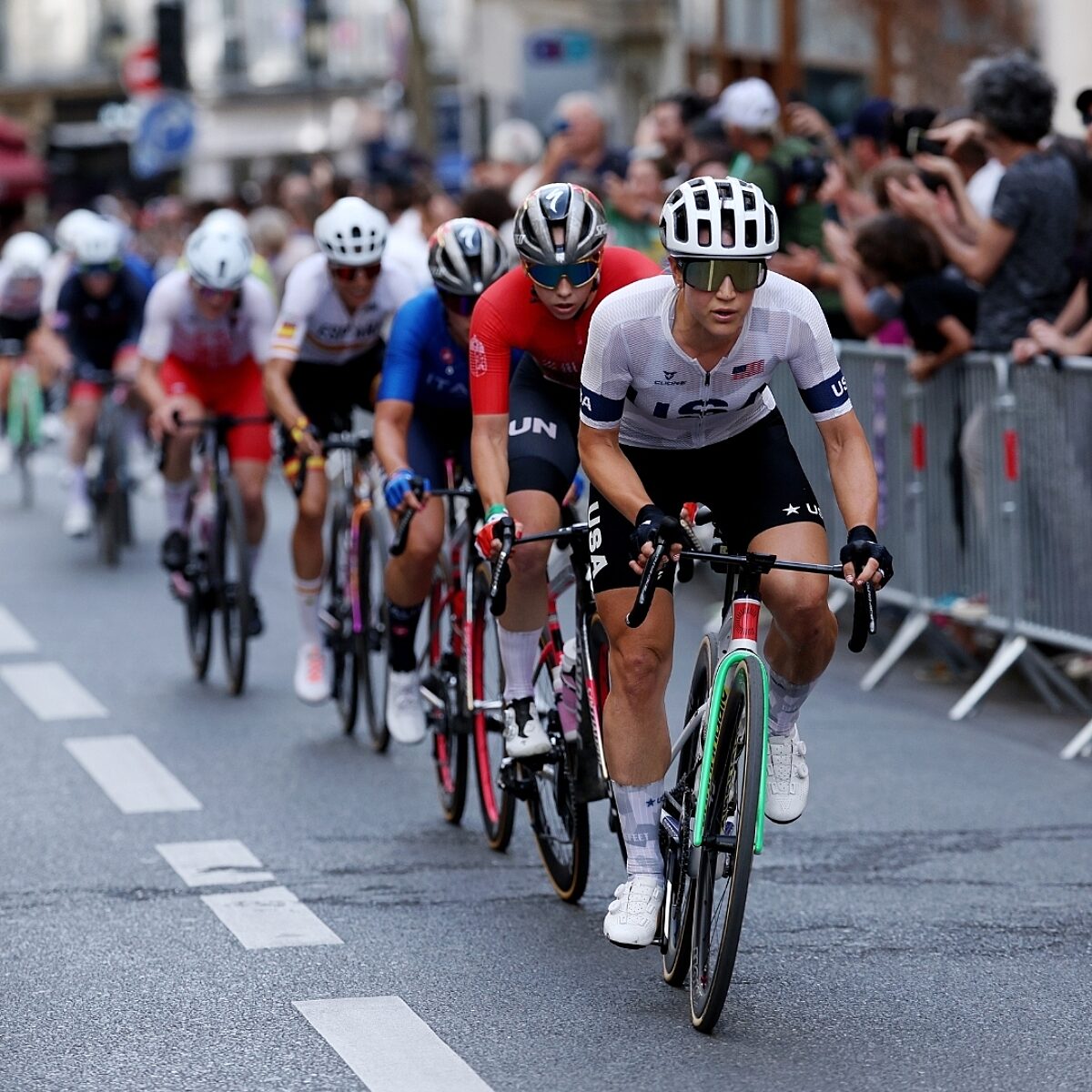 Kristen Faulkner leading a pack of road racers.