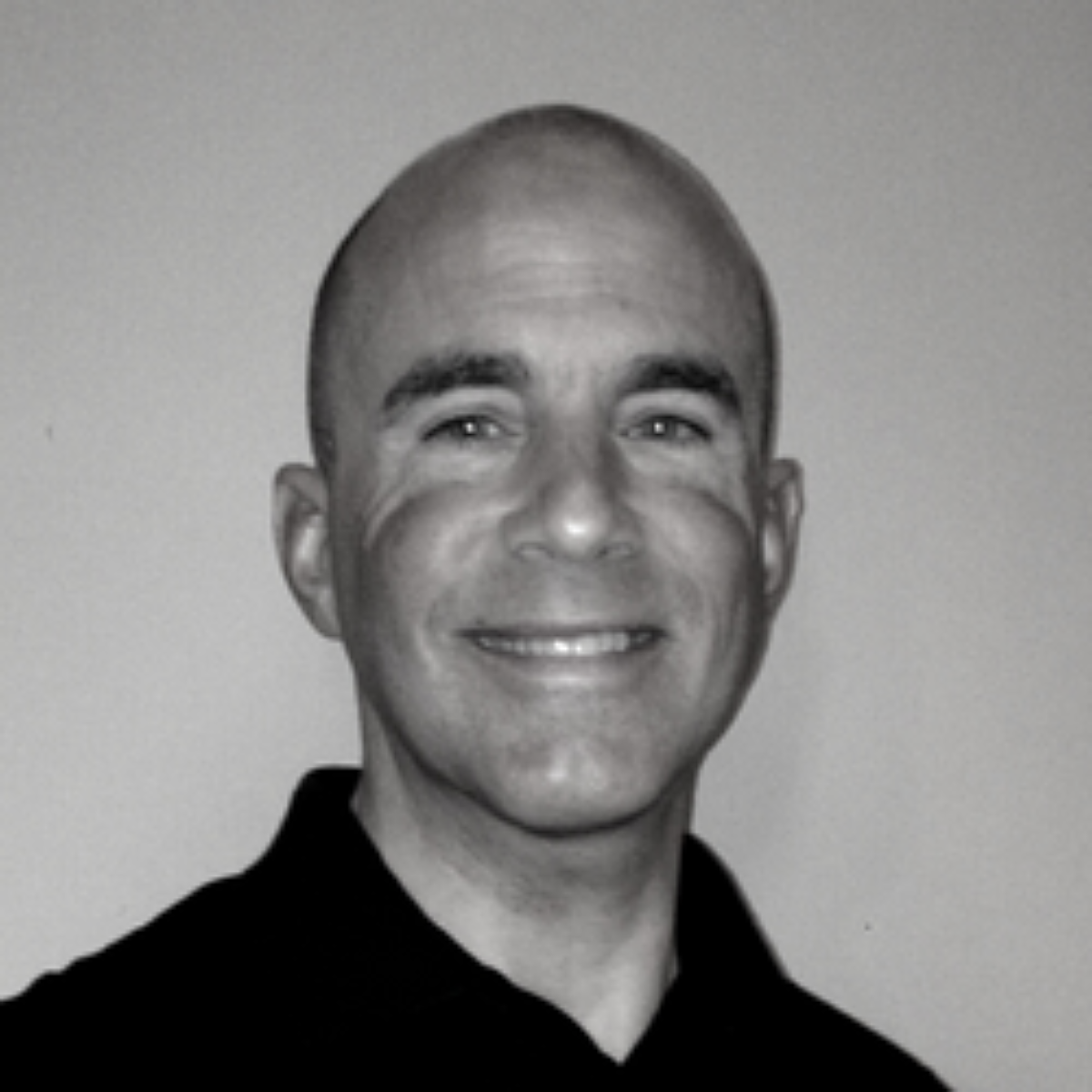 Michael Cole smiling for a photo.